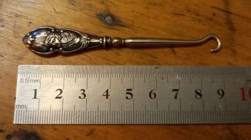 Silver handled boot hook with stunning cherub design, 1903