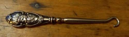 Silver handled boot hook with stunning cherub design, 1903