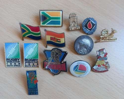 Great lot of 13 vintage South African lapel pin badges, including Voortrekker Monument