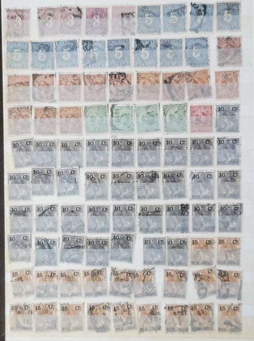 Netherlands Indies stamp album with more than 1 000 used stamps 1870 onwards