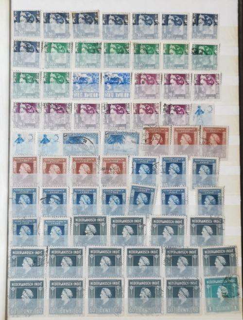 Netherlands Indies stamp album with more than 1 000 used stamps 1870 onwards