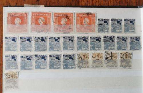 Netherlands Indies stamp album with more than 1 000 used stamps 1870 onwards