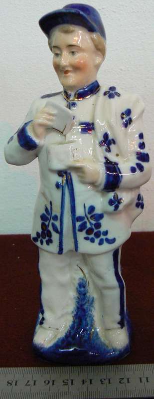Porcelain postman figurine