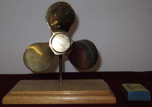Copper propellor mounted on wood - desk ornament