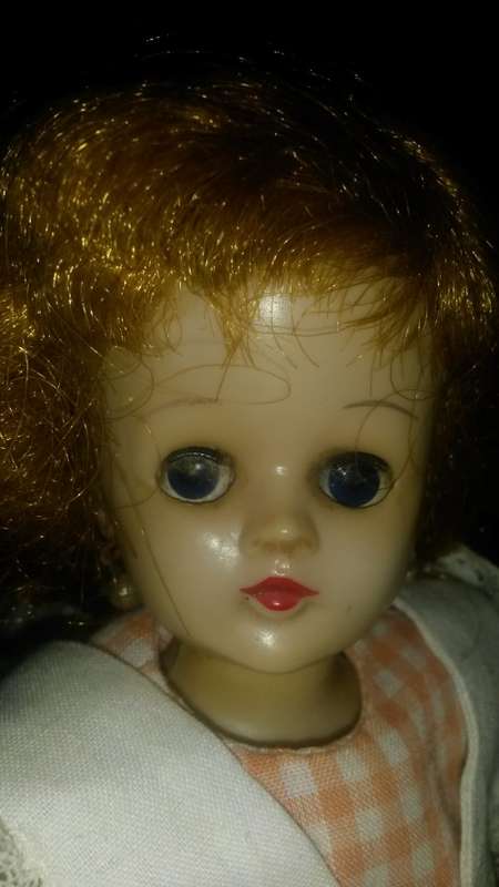 Vintage Doll wearing original dress and shoes