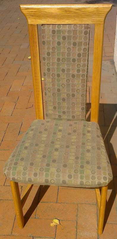 SOLID OAK HIGHBACK CHAIR with upholstered seat and padded backrest.