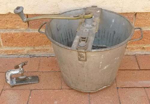 Very old (galvanized?) iron dough mixer with brass mixing handle
