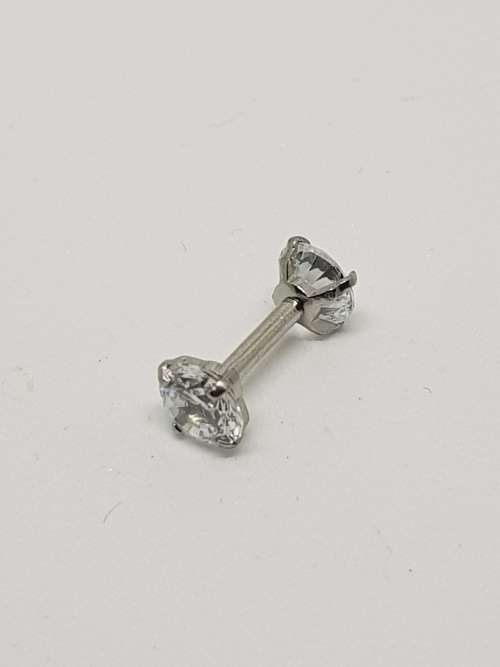 Silver barbell piercing