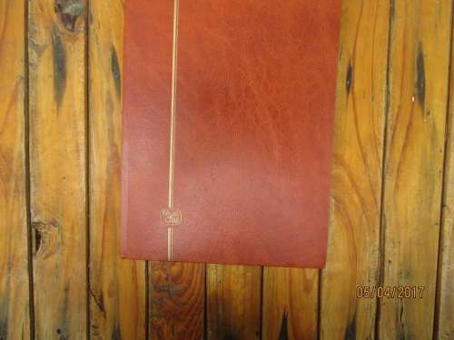 A4 KABE BROWN STOCK BOOK MIXED WORLD REQUIRES SORTING. BOOK HAS FOXING