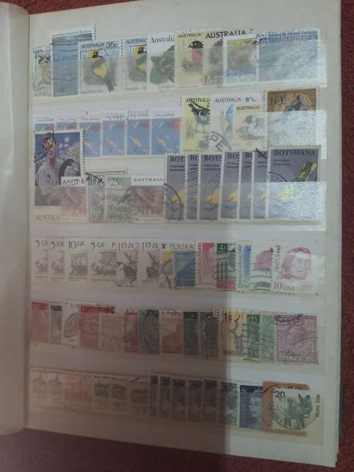 A5 GREEN STOCKBOOK LOADED WITH MIXED WORLD STAMPS 16/32 PAGE