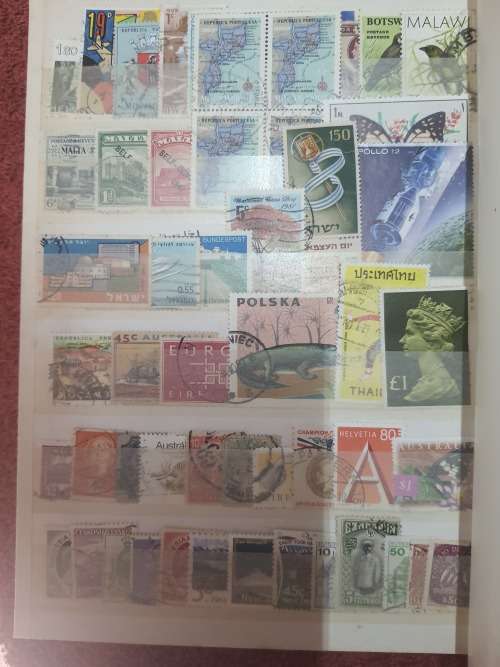 A5 GREEN STOCKBOOK LOADED WITH MIXED WORLD STAMPS 16/32 PAGE