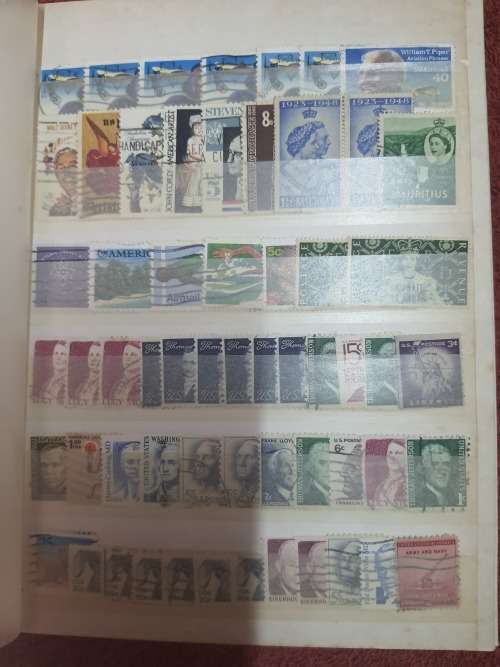 A5 GREEN STOCKBOOK LOADED WITH MIXED WORLD STAMPS 16/32 PAGE