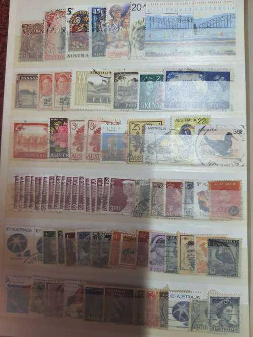 A5 GREEN STOCKBOOK LOADED WITH MIXED WORLD STAMPS 16/32 PAGE