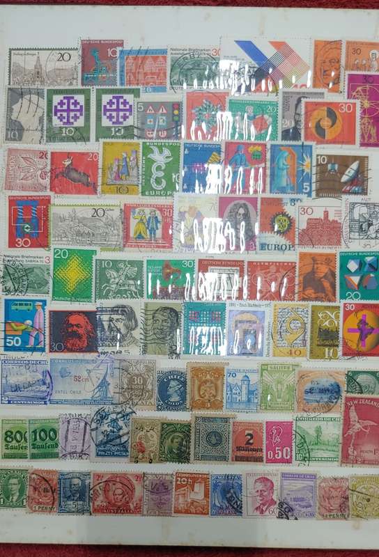 USED A4 STOCKBOOK FULL OF MIXED WORLDS STAMPS 12/24 PAGES