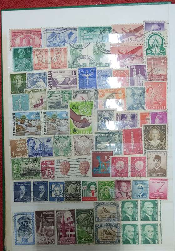 USED GREEN A4 STOCKBOOK FULL OF MIXED WORLD STAMPS 8/16 PAGES