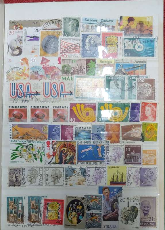 USED GREEN A4 STOCKBOOK FULL OF MIXED WORLD STAMPS 8/16 PAGES