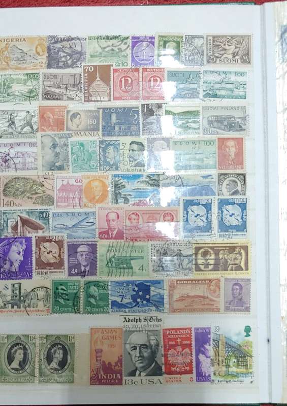 USED GREEN A4 STOCKBOOK FULL OF MIXED WORLD STAMPS 8/16 PAGES