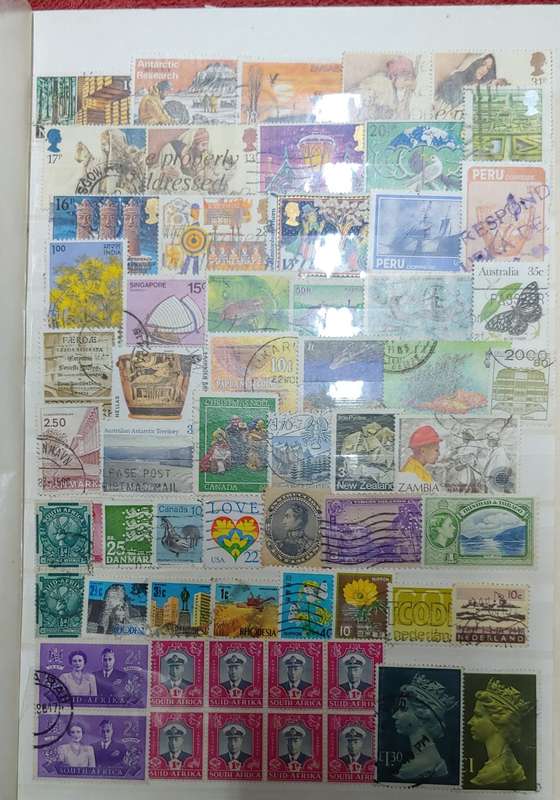 USED GREEN A4 STOCKBOOK FULL OF MIXED WORLD STAMPS 8/16 PAGES