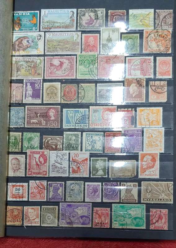 USED MAROON A4 STOCKBOOK WITH BLACK PAGES MIXED WORLD STAMPS 8/16 PAGES