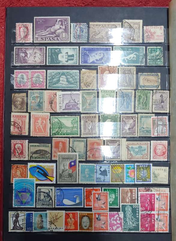 USED MAROON A4 STOCKBOOK WITH BLACK PAGES MIXED WORLD STAMPS 8/16 PAGES