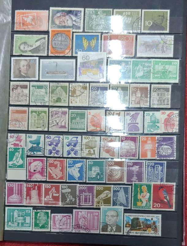 USED MAROON A4 STOCKBOOK WITH BLACK PAGES MIXED WORLD STAMPS 8/16 PAGES