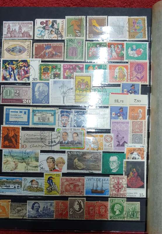 USED MAROON A4 STOCKBOOK WITH BLACK PAGES MIXED WORLD STAMPS 8/16 PAGES