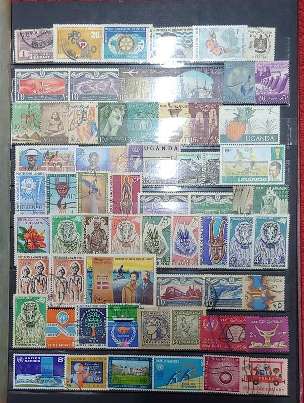 USED MAROON A4 STOCKBOOK WITH BLACK PAGES MIXED WORLD STAMPS 8/16 PAGES