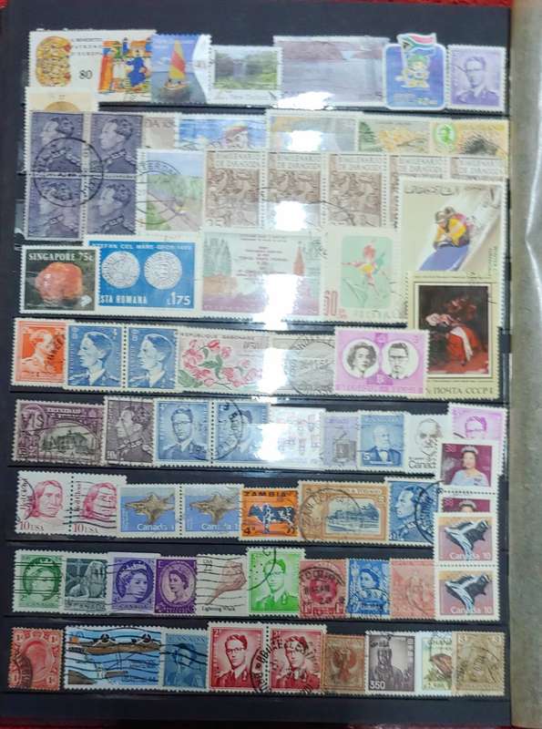 USED MAROON A4 STOCKBOOK WITH BLACK PAGES MIXED WORLD STAMPS 8/16 PAGES