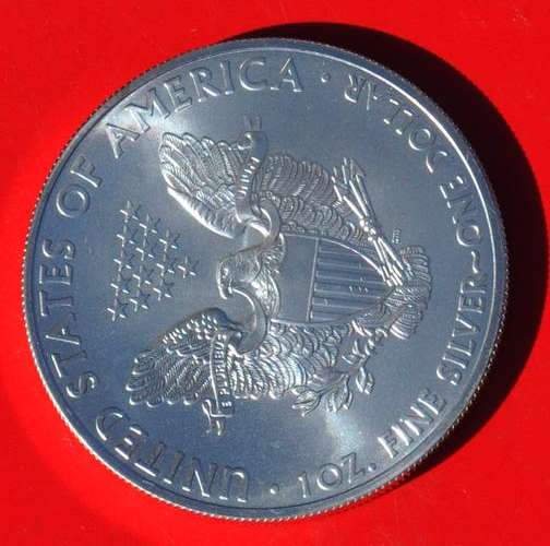 1oz FINE SILVER - 1 US-$ SILVER DOLLAR 2011  One side of the coin with begin of natural toning 1Oz