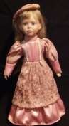 Porcelain doll with stand. (+- 44cm Tall)