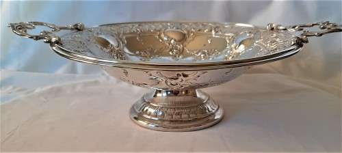 Large Silver Plated ornate handles fruit dish on stand, has been re-plated, no damages or cracks