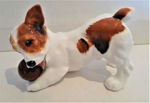 Delightful Royal Doulton puppy playing with a ball in its mouth, practically mint, no damages!