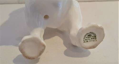 Delightful Royal Doulton puppy playing with a ball in its mouth, practically mint, no damages!