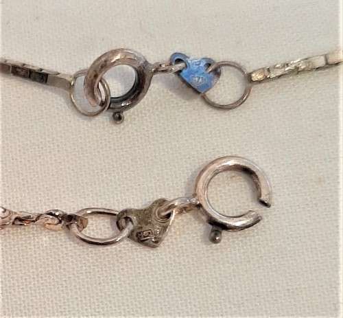 Two sterling silver neck chains, one with pendant, both for one bid, 7.6gr