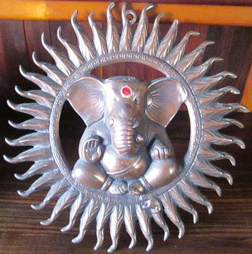 Ganesha with Sun surround bronzed wall hanging