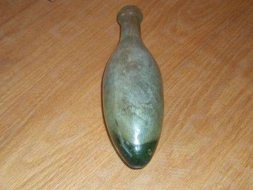 Vintage or antique glass bottle torpedo shaped