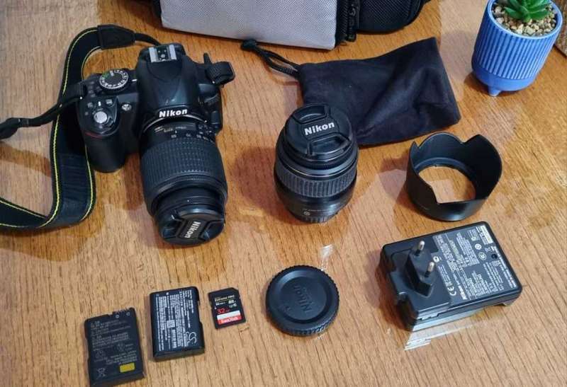 Nikon D3100 DSLR Camera with two lenses and accessories in excellent condition