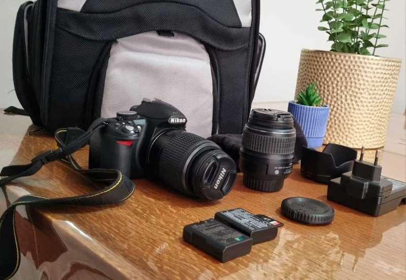Nikon D3100 DSLR Camera with two lenses and accessories in excellent condition