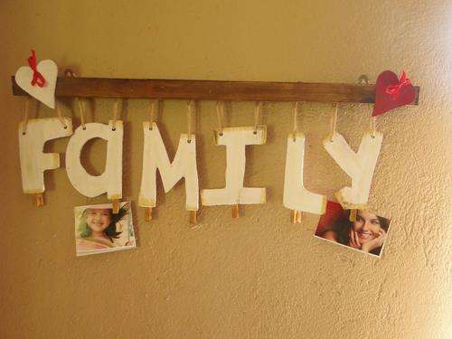 Handmade hanging photo holder with "family"