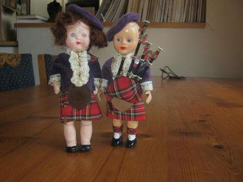 Two small pastic dolls in Scots garb...
