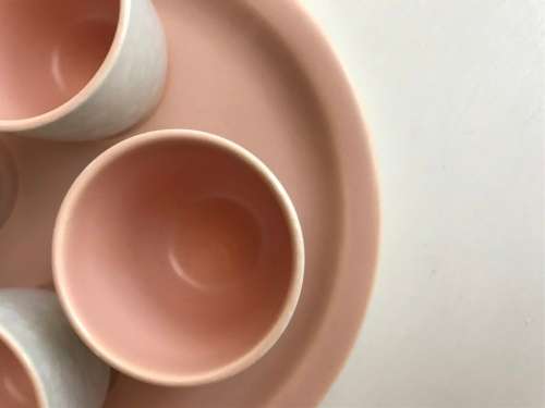 Poole pottery twin tone four-egg cup breakfast set with stand