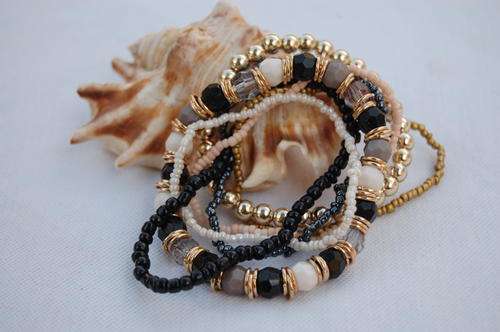 MULTI STRAND BROWN , GOLD BRACELET