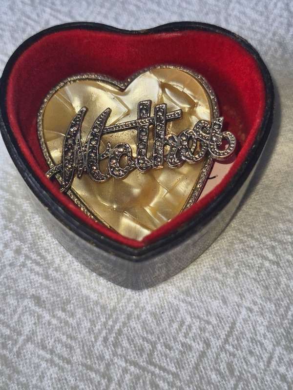 Vintage `Mother` brooch on mother of pearl in hart shape box