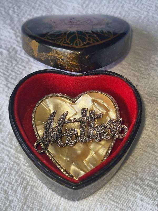 Vintage `Mother` brooch on mother of pearl in hart shape box