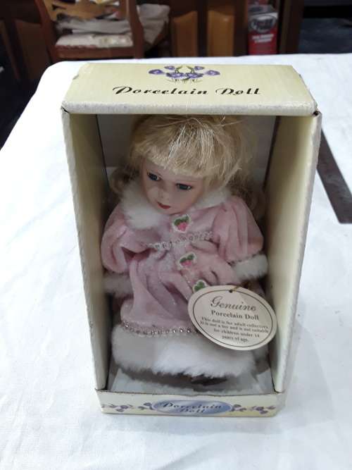 GENUINE PORCELAIN DOLL IN BOX