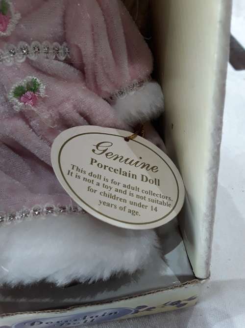 GENUINE PORCELAIN DOLL IN BOX