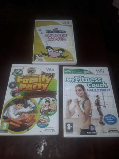 NINTENDO WII INCLUDING POWER SUPPLY, 7 GAME DISCS AND ASSESCORIES