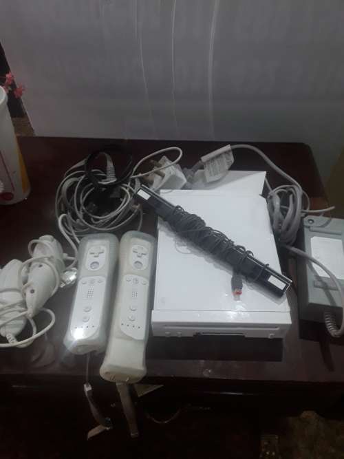 NINTENDO WII WITH POWER SUPPLY, 2 REMOTES AND ASSESCORIES