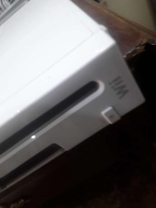 NINTENDO WII WITH POWER SUPPLY, 2 REMOTES AND ASSESCORIES