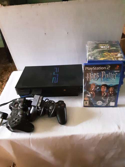PS2 CONSOLE INCL.POWER SUPPLY, 2 REMOTES AND 13 GAME DISCS